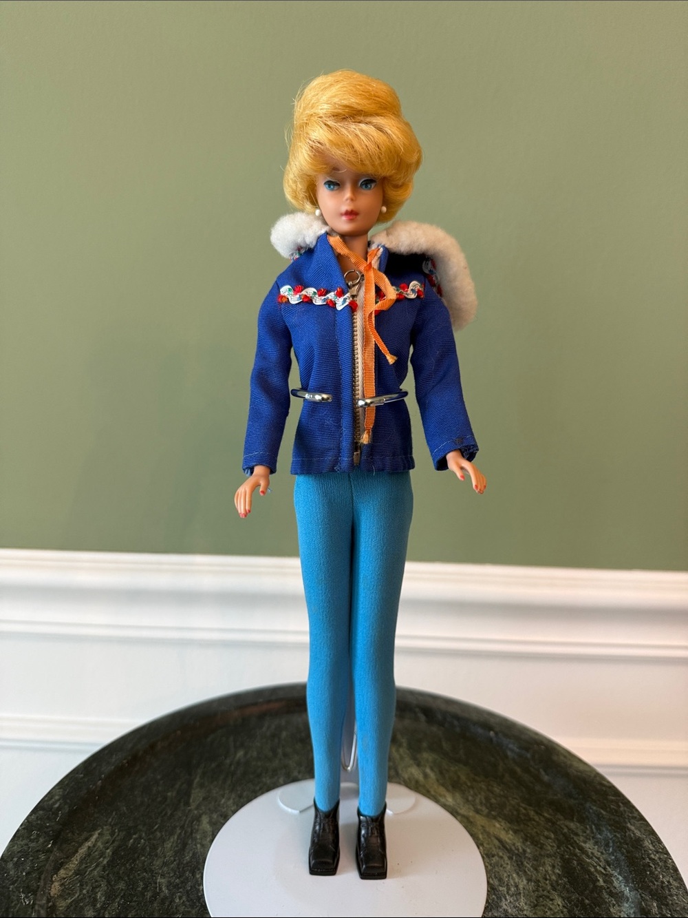 1963–1965 Bubblecut Barbie Doll with mixed vintage outfits